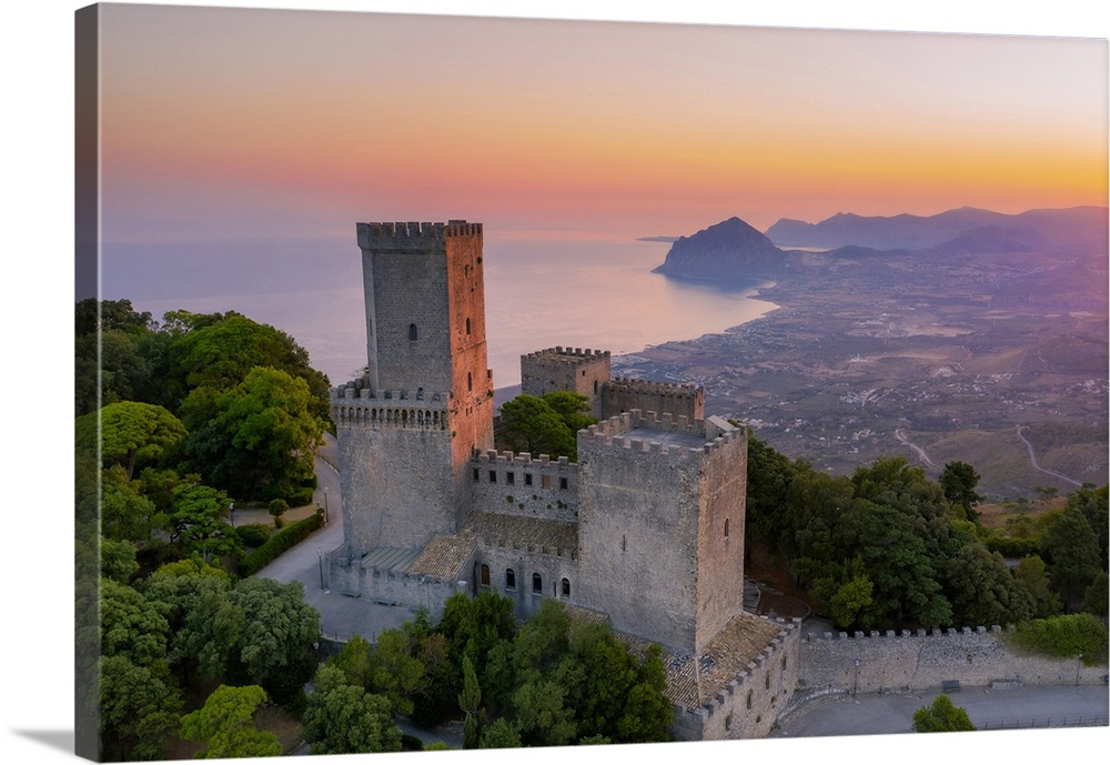 Erice, Sicily. The Norman castle at sunrise, view towards Monte Cofano and Riserva dello Zingaro mountains