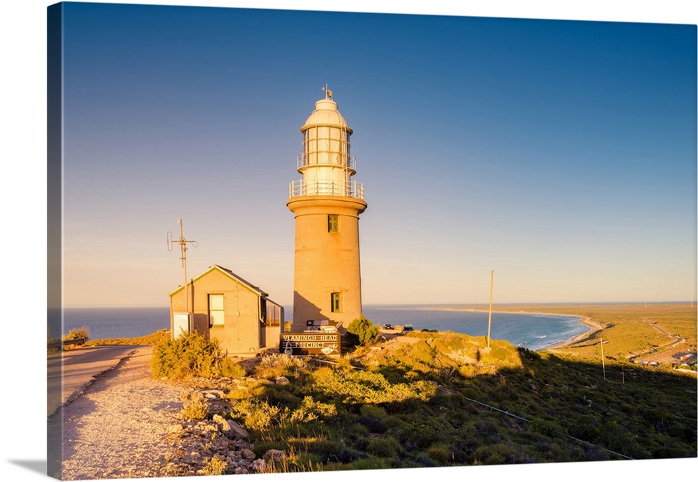 Exmouth lighthouse (Vlamingh Head Lighthouse), Exmouth, Western Australia, Australia. Lighthouse at sunset.