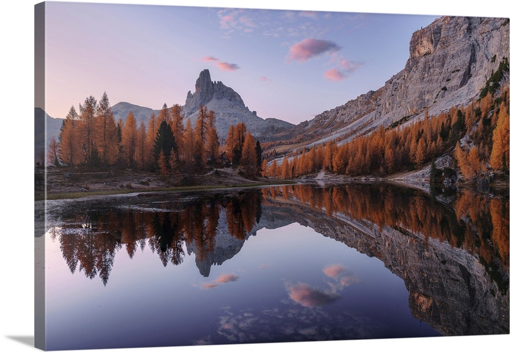 Federa lake in autumn surrounded by larches at sunrise, Dolomites, Italy