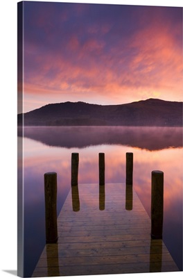 Fiery sunrise over Derwent Water from Hawes End jetty, Cumbria, England
