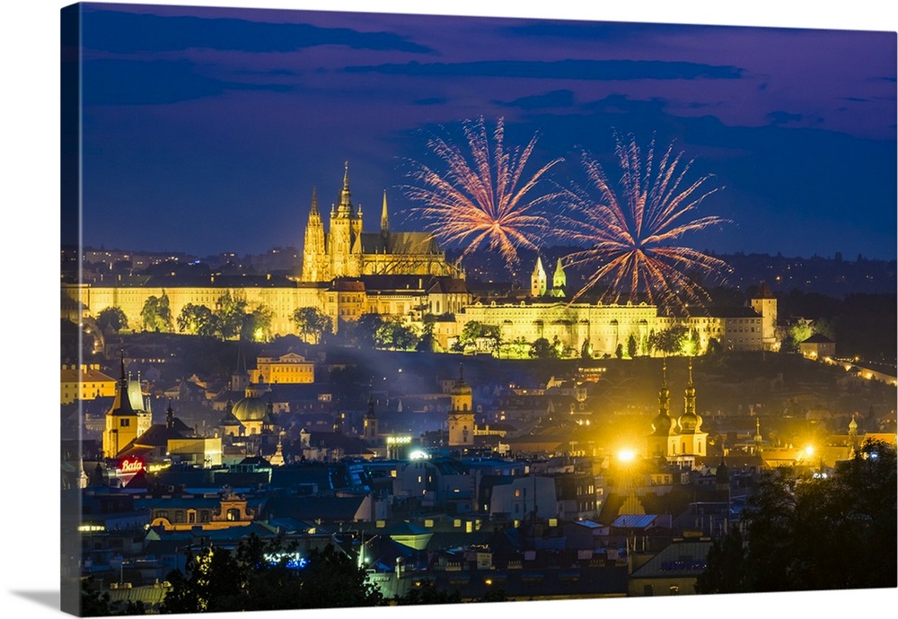 Czech Republic, Prague, Vinohrady. Fireworks over Prague Castle, Prazsky Hrad, from Riegroy Sady park at dusk.