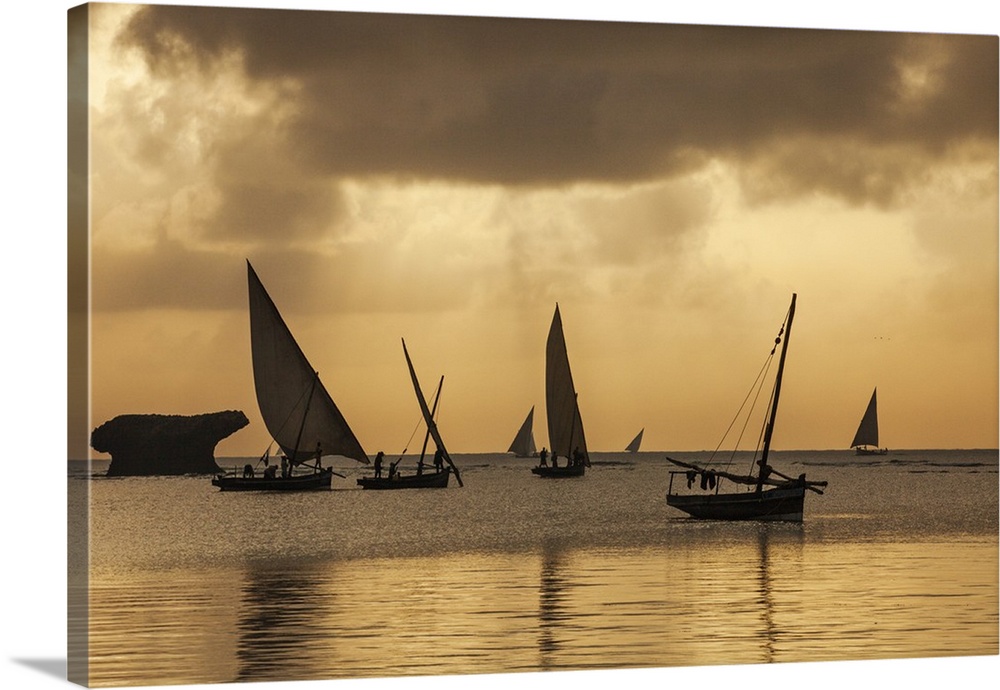 Kenya, Watamu, Kilifi County, Coast. Fishermen in traditional wooden sailing boats leave Watamu at sunrise to fish in the ...