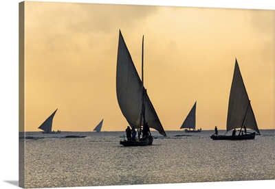 Fishermen in wooden sailing boats leave Watamu at sunrise to fish in the Indian Ocean