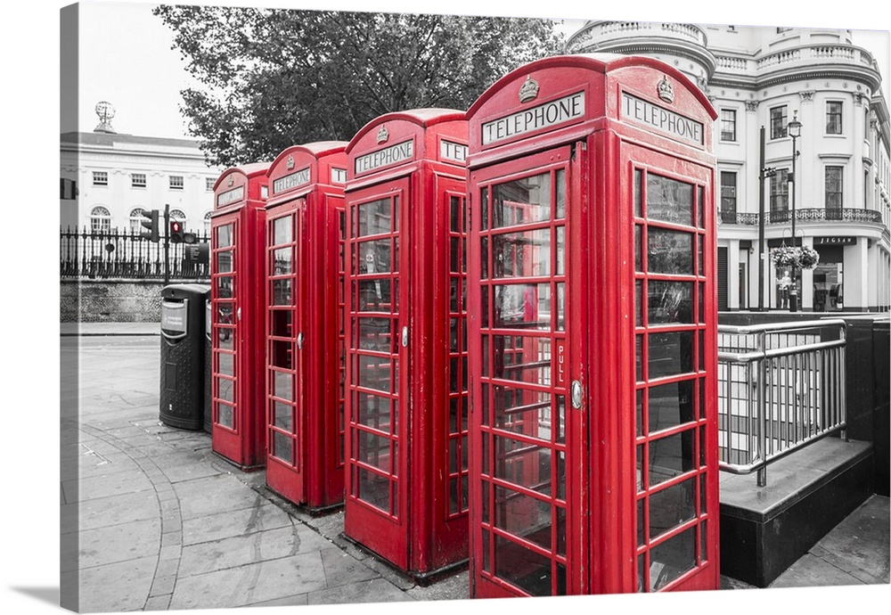 Four red telephone boxes, London, England, UK.