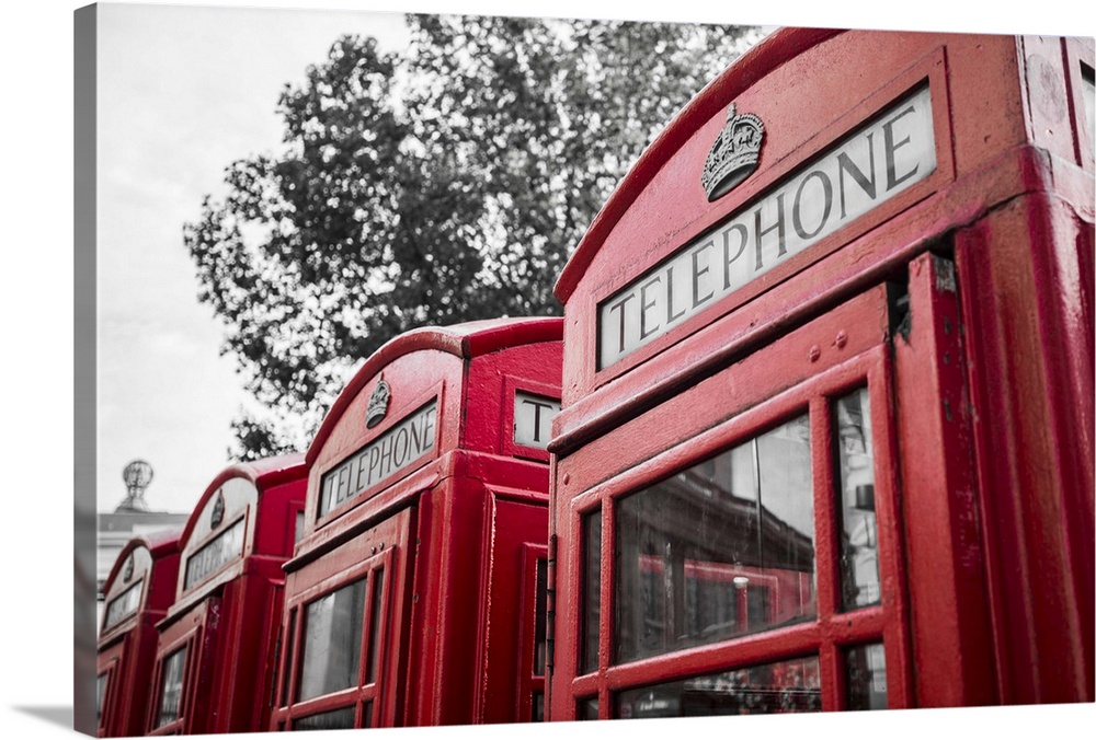 Four red telephone boxes, London, England, UK.