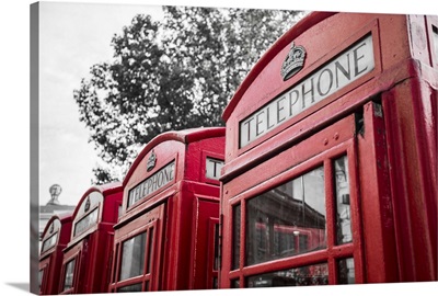 Four red telephone boxes, London, England, UK