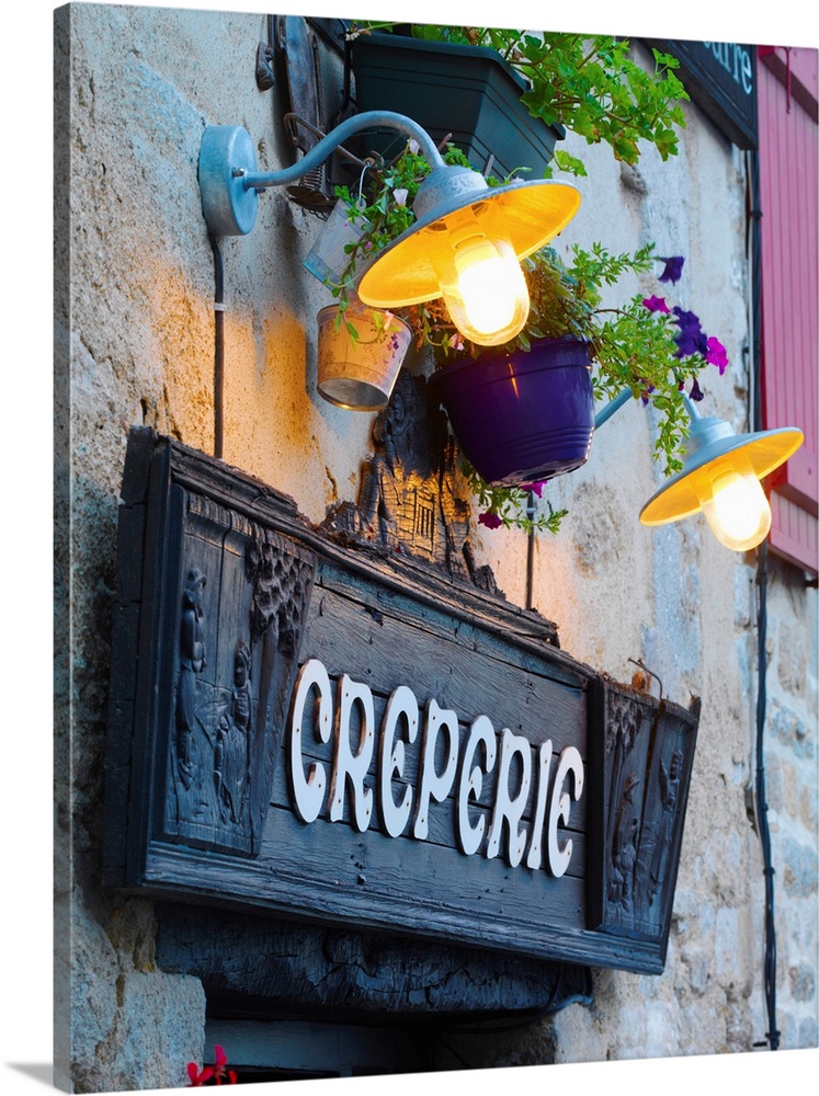 France, Brittany, Finistere, Quimper, Old town, Creperie sign at dusk.