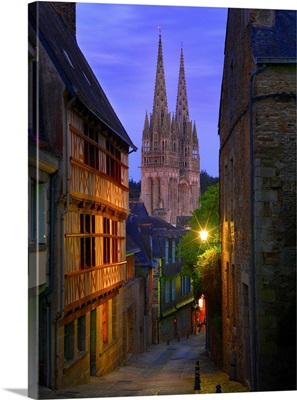 France, Brittany, View Down Cobbled Street To Saint Corentin Cathedral At Dusk