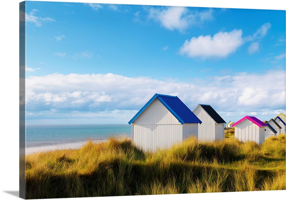 France, Normandy, Gouville Sur Mer, colourful beach huts.