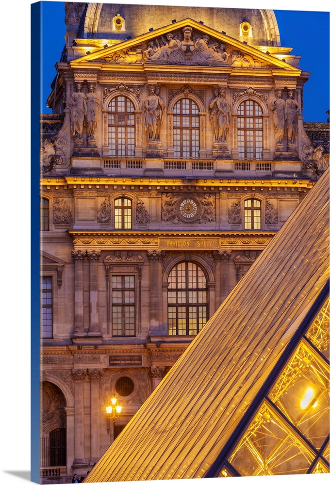 France, Paris, The Louvre, Pyramid at dusk.