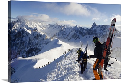French Alps, skiers walking down the ridge at the start of Vallee Blanche off piste
