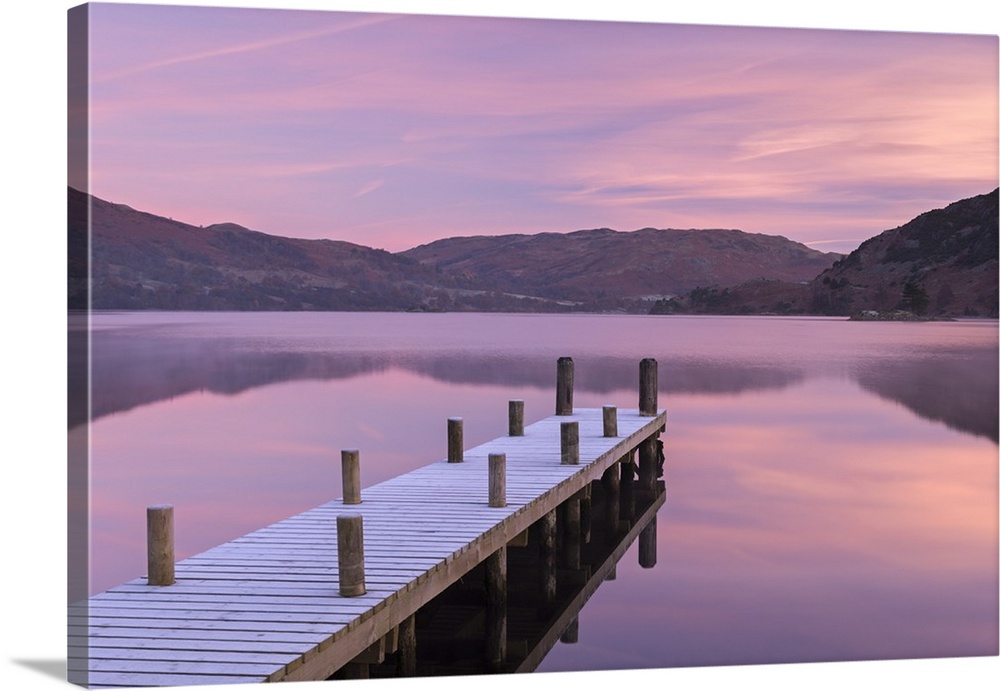 Frosty wooden jetty on Ullswater at dawn, Lake District, Cumbria, England. Winter (November)