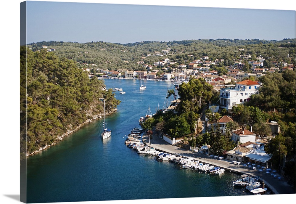 Greece, Paxos. Yachts and pleasure boats moored in the entrance to Gaios harbour between Gaios and the islands of Agios Ni...