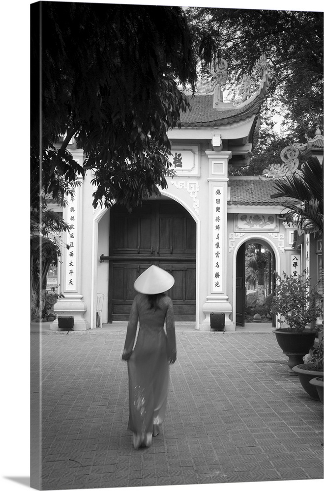 Girl wearing Ao Dai dress, Tran Quoc Pagoda, West Lake (Ho Tay), Hanoi, Vietnam