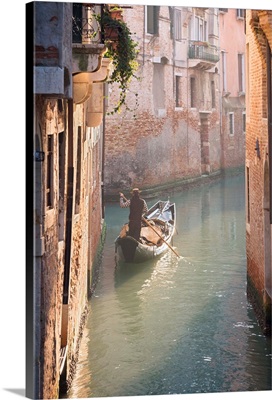 Gondola And Gondolier In A Small Venetian Canal, Venice, Veneto, Italy