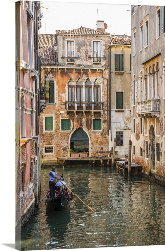 Gondola on canal in Venice, Veneto, Italy.