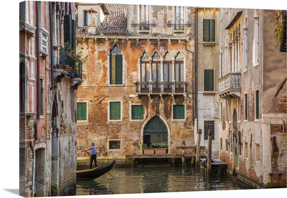 Gondola on canal in Venice, Veneto, Italy.