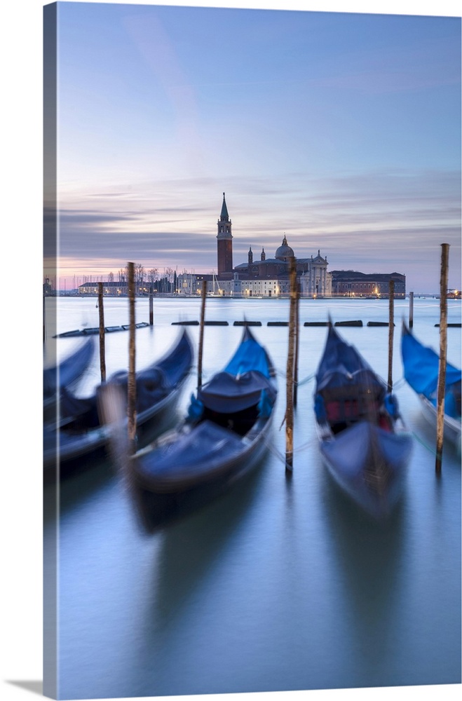 Gondolas on the lagoon at dawn, with San Giorgio Maggiore in the background, San Marco, Venice, Italy