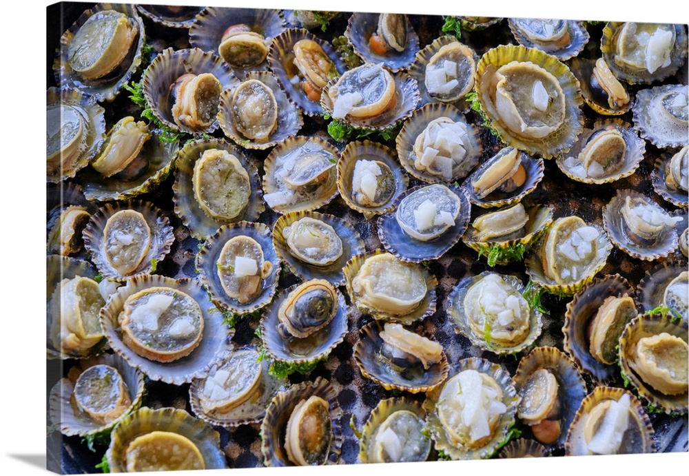 Grilled limpets with garlic, a delicacy. Moledo do Minho, Portugal