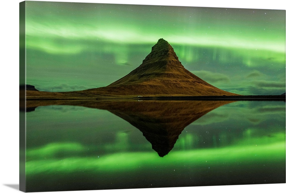Grundafjordur, Snaefellsness peninsula, Western Iceland. Kirkjufell mountain reflecting in the waters of the lake with the...