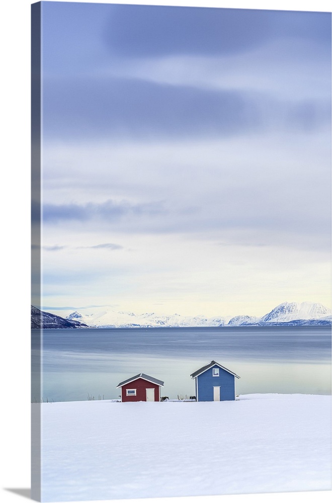 High Angle View Of Lone Fisherman Cabins On A Snowy Beach, Tromso, Norway