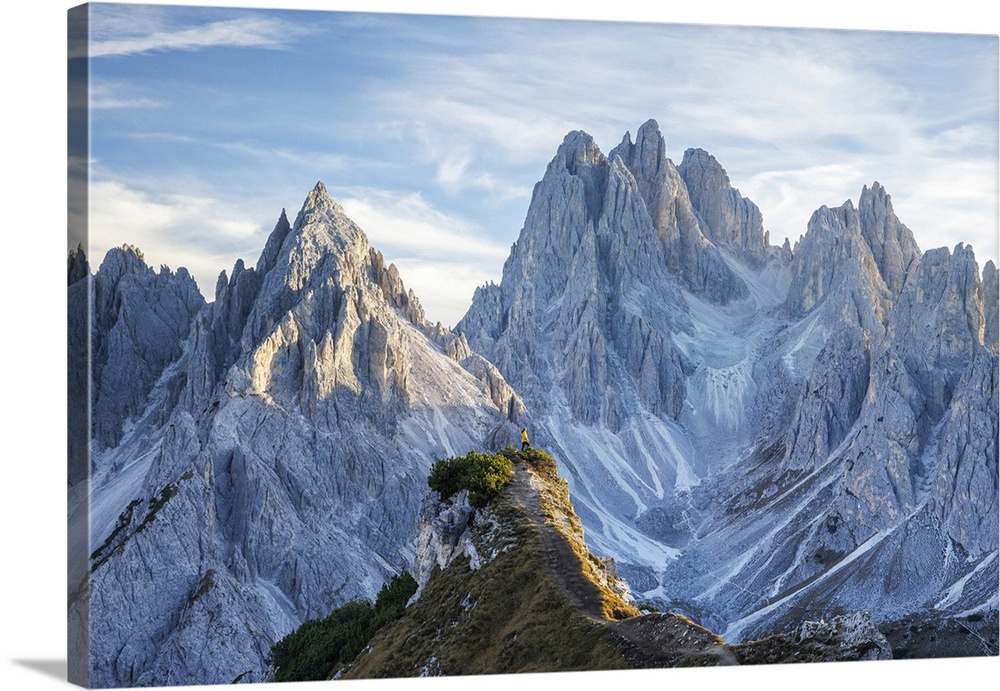 Hiker on ridge with the Cadini di Misurina mountains beyond, Dolomites, Trentino Alto Adige, Italy