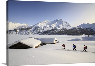 Hikers on snowshoes, Spluga, Maloja Pass. Engadine. Switzerland