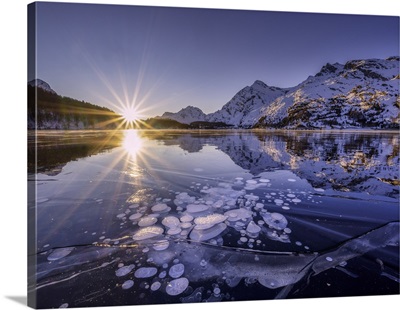 Ice Bubbles Trapped In The Frozen Lake Sils During A Sunset, Engadine, Switzerland
