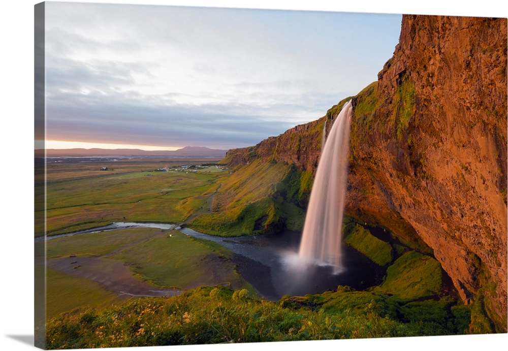 Iceland, southern region, Seljalandsfoss waterfall, sunset.