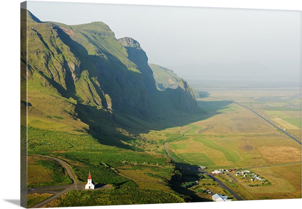 Iceland, southern region, Vik, church and coastal scenery.