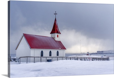 Iceland: The Little Church Of Reynisfjara Looking At The Storm On The Seashore