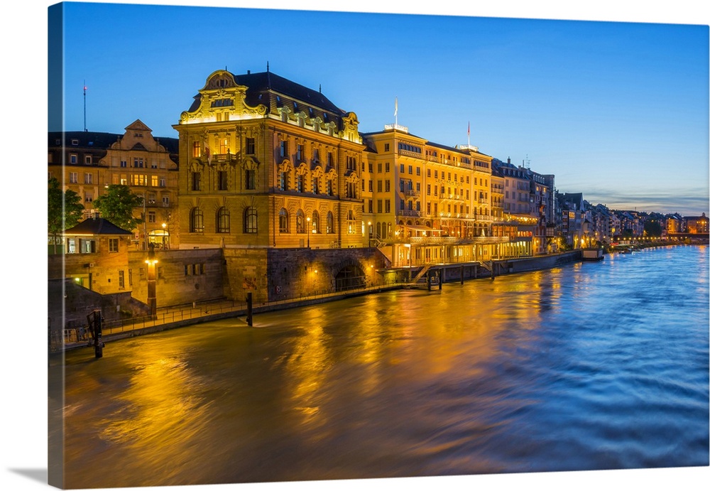 Illuminated Hotels at river Rhine at Basel at dusk, Canton Basel, Switzerland.