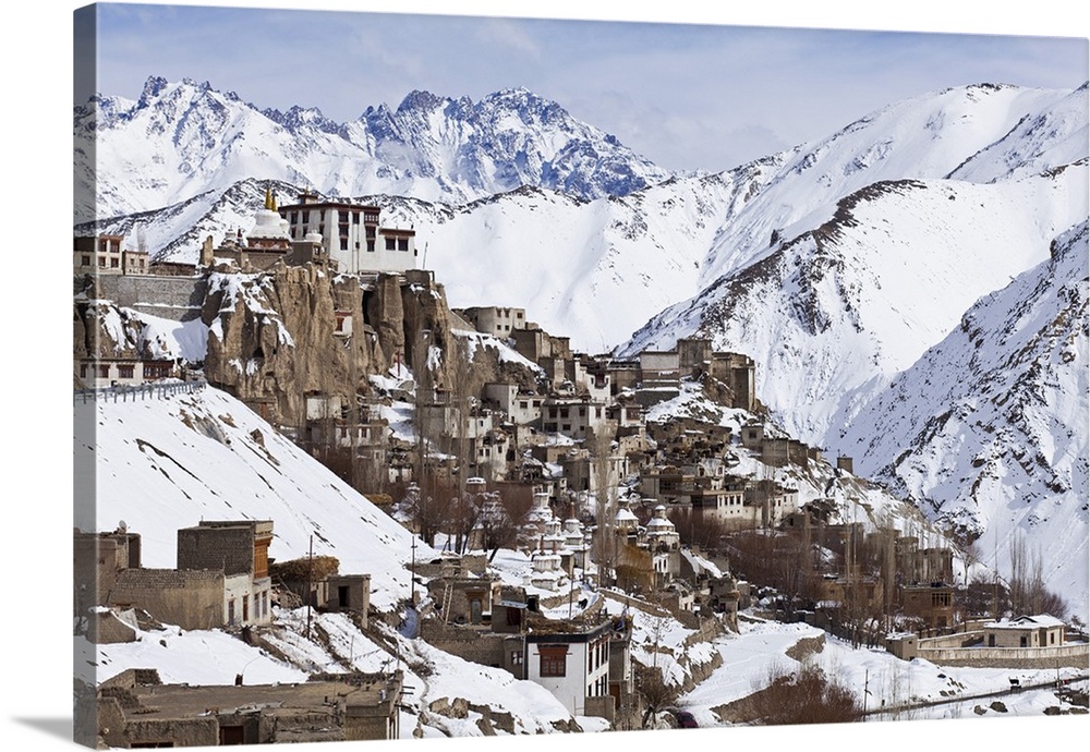 India, Ladakh, Lamayuru. Lamayuru Monastery, remote and isolated, hemmed in by dramatic snow covered mountains.