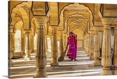 India, Rajasthan, Jaipur, Amer, A woman sweeps the floor of a pavilion in the Amber Fort