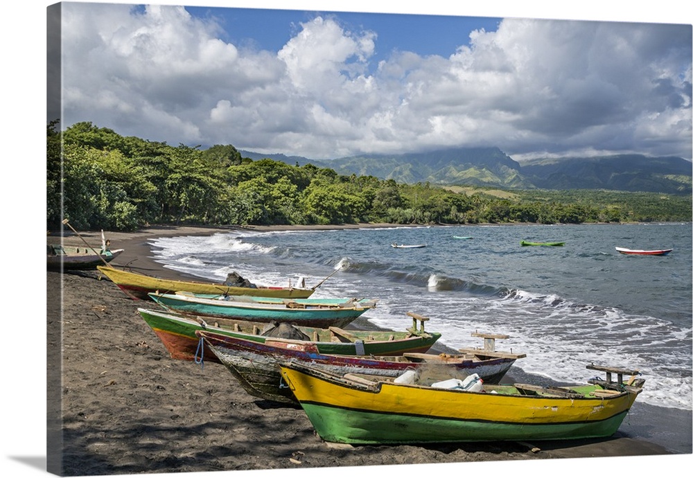 Indonesia, Flores Island, Waelengga. The beach with fishing boats at Waelengga. The dark sand highlights the volcanic natu...