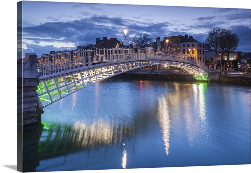 Ireland, Dublin, Hapenny Bridge over the River Liffey, dusk.