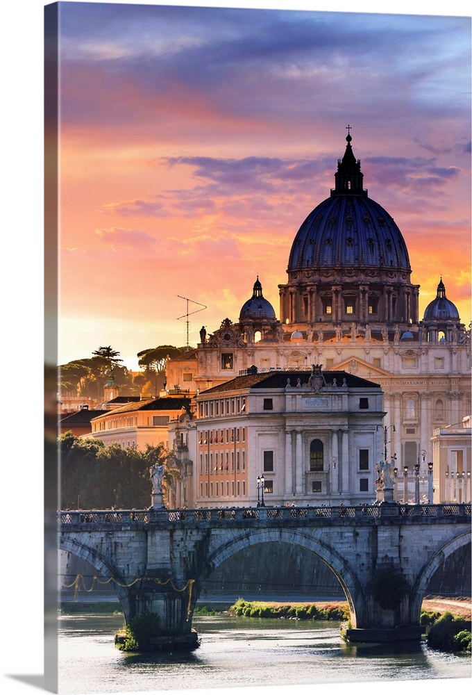 Italy, Rome, St. Peter Basilica at sunset reflecting on Tevere river