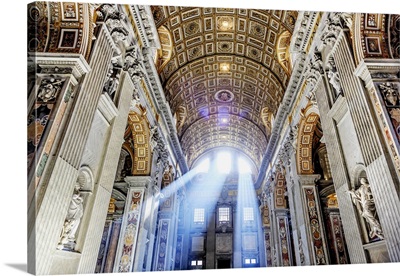 Italy, Rome, St. Peter Basilica interior with sun lights penetrating through the windows