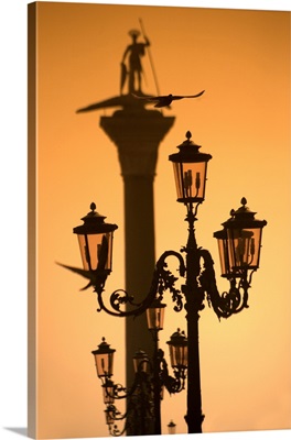 Italy, the statue of St. Mark, with lamp posts in the foreground