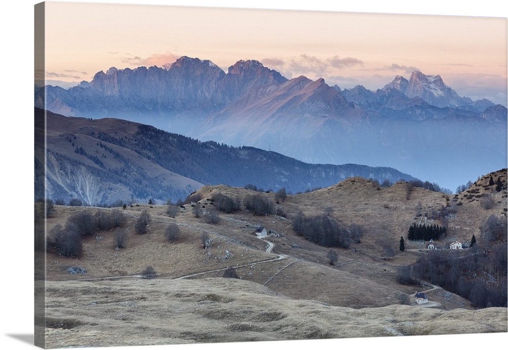Europe, Italy, Veneto, Treviso, Cansiglio. View towards the Dolomites from mount Pizzoc at sunset.