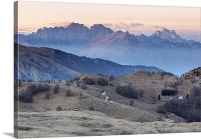 Italy, Veneto, Treviso, Cansiglio. View towards the Dolomites at sunset