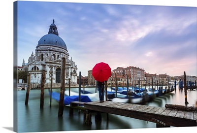 Italy, Veneto, Venice, woman standing with red umbrella