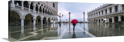 Italy, Veneto, Venice. Woman with red umbrella