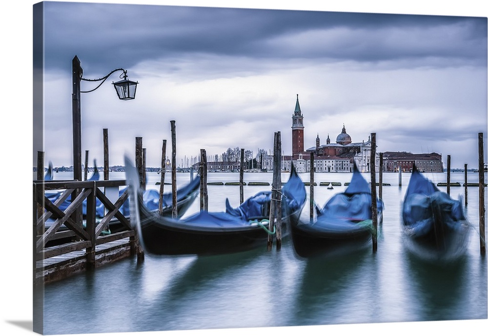 Italy, Veneto, Venice. Gondolas at dawn with San Giorgio Maggiore church on the background.