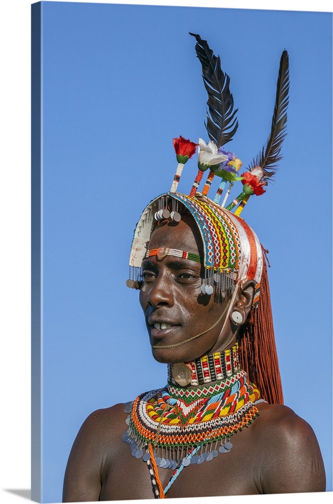 Kenya, Kirimun, Samburu County. A portrait of a Samburu warrior in all his finery.