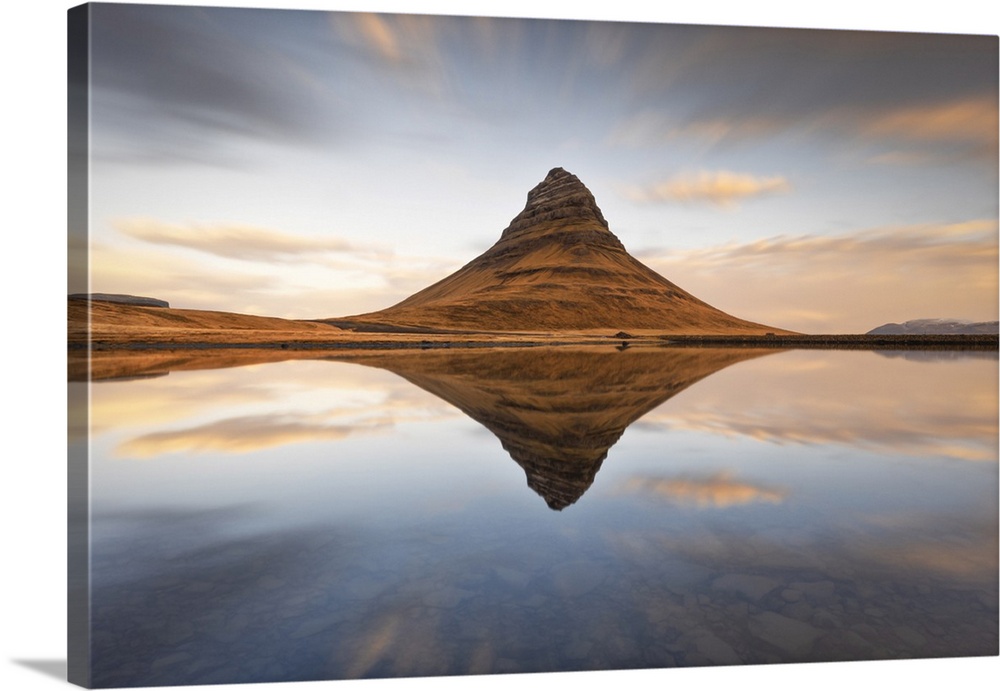 Kirkjufell mount reflected in a little lagoon during a winter sunrise, Snaefells Peninsula, Vesturland, Iceland