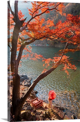 Kyoto, Japan, Woman With Red Umbrella And Kimono Admiring The View On Katsura River