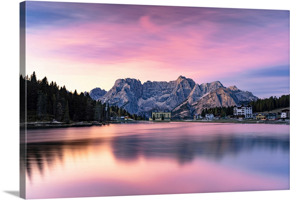 Romantic pink sky at dawn over lake Misurina and Sorapiss mountain peak in autumn, Dolomites, Belluno province, Veneto, Italy