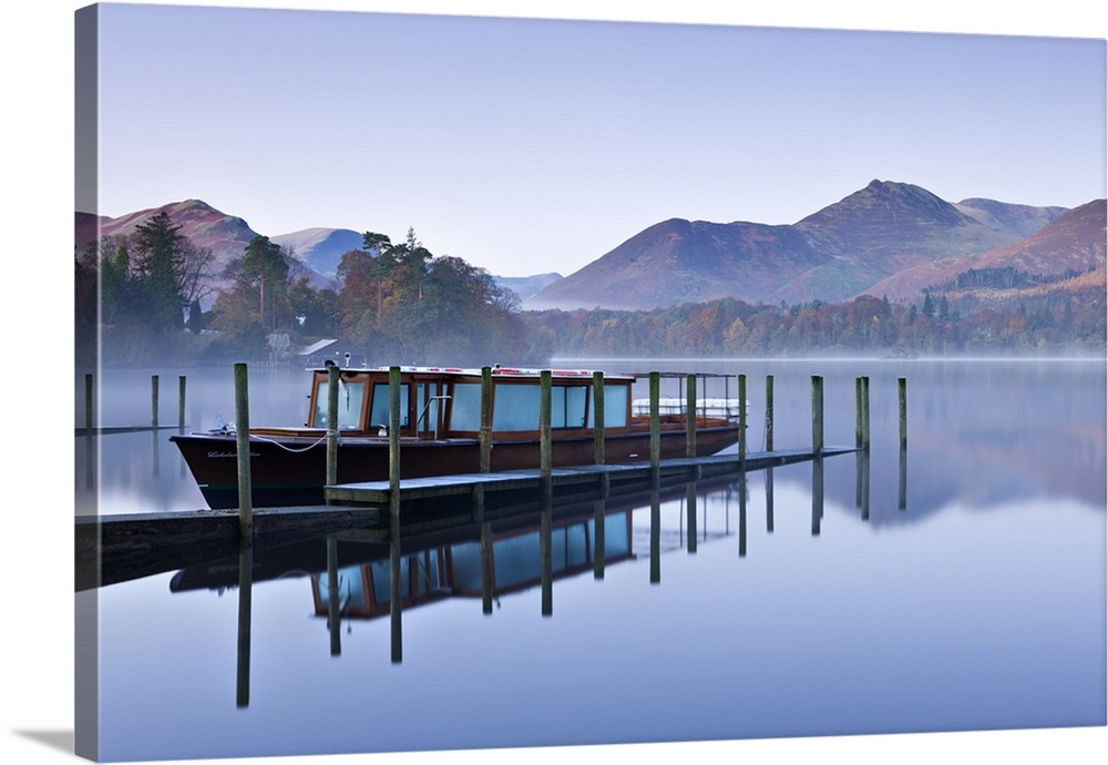 Lakeland Mist pleasure boat moored on a placid Derwent Water on a misty and frosty morning, Keswick, Lake District Nationa...