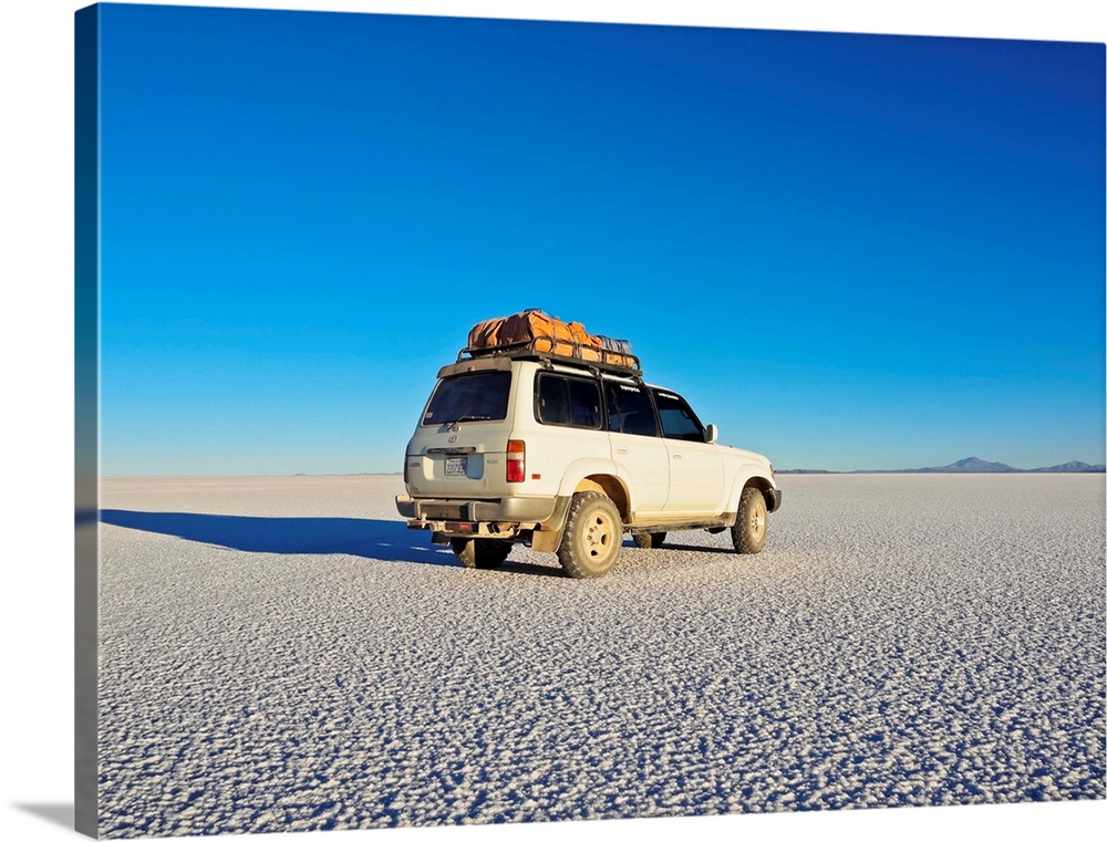 Bolivia, Potosi Department, Daniel Campos Province, White Toyota Landcruiser on the Salar de Uyuni, the largest salt flat ...